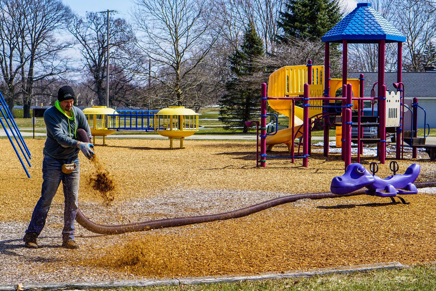 covering a playground in mulch