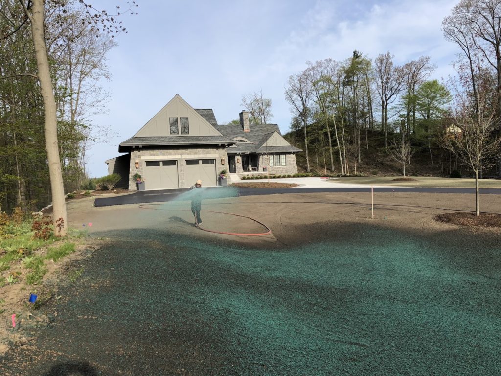 Hydroseeding in wooded neighborhood