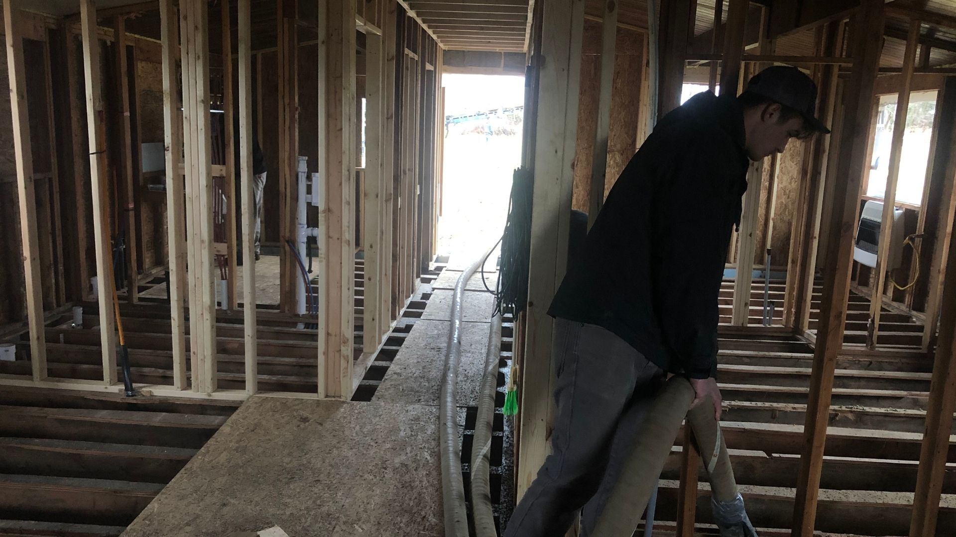 man working on a crawl space