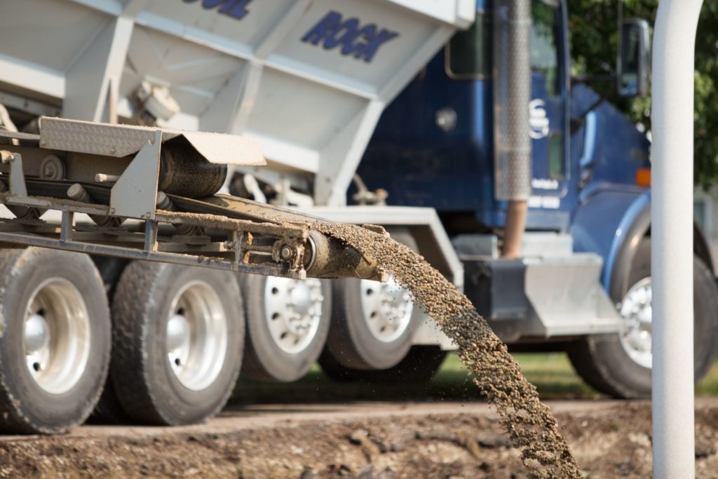 Truck pouring stone