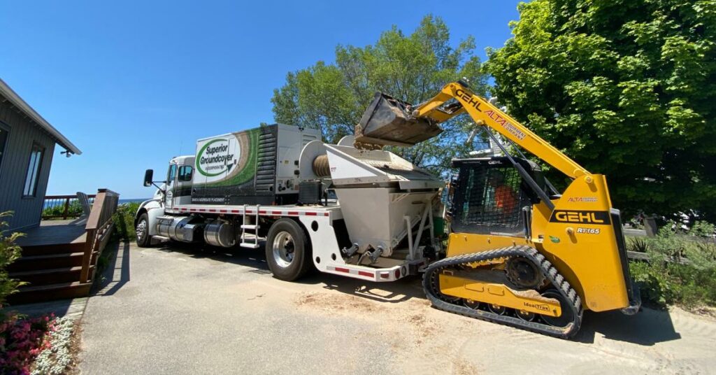 Superior Groundcover truck installing sand