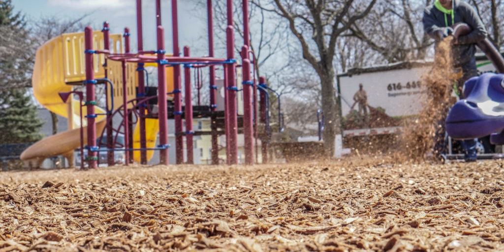 mulch being installed on a playground