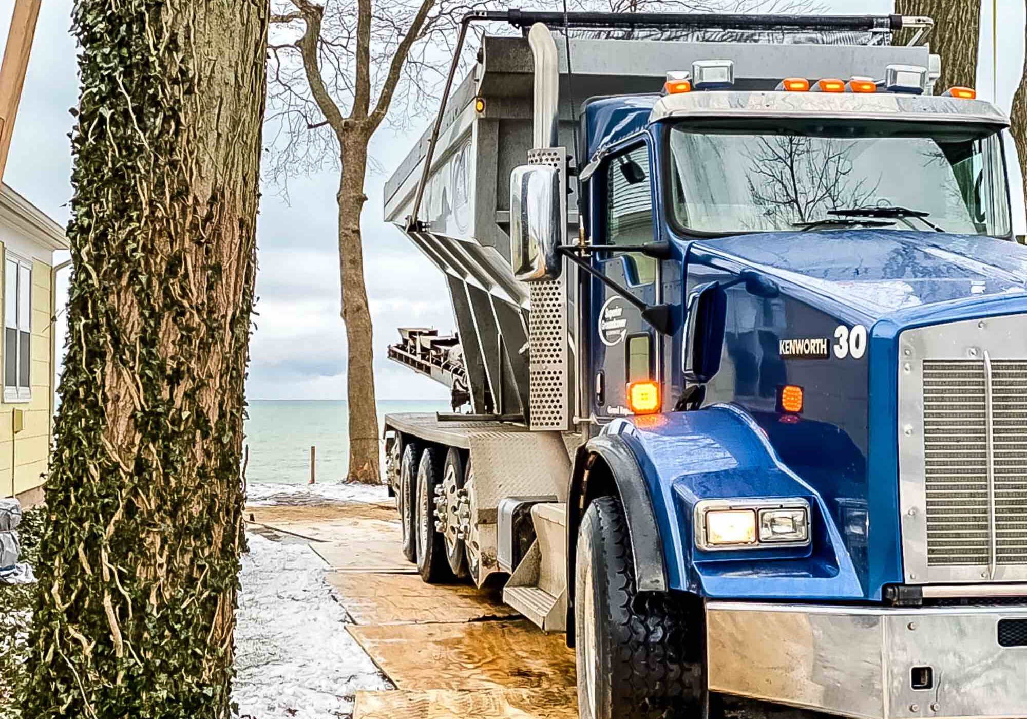 Superior stone slinger truck conveying sand