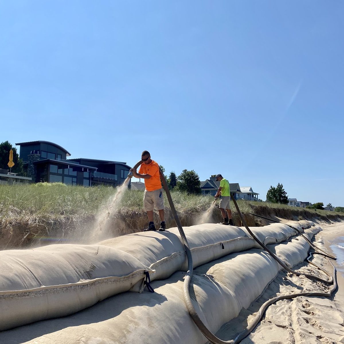 filling geotextile bags with clean sand sand bag installation backfill