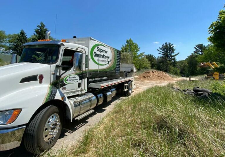 Superior Groundcover truck on a sand installation site